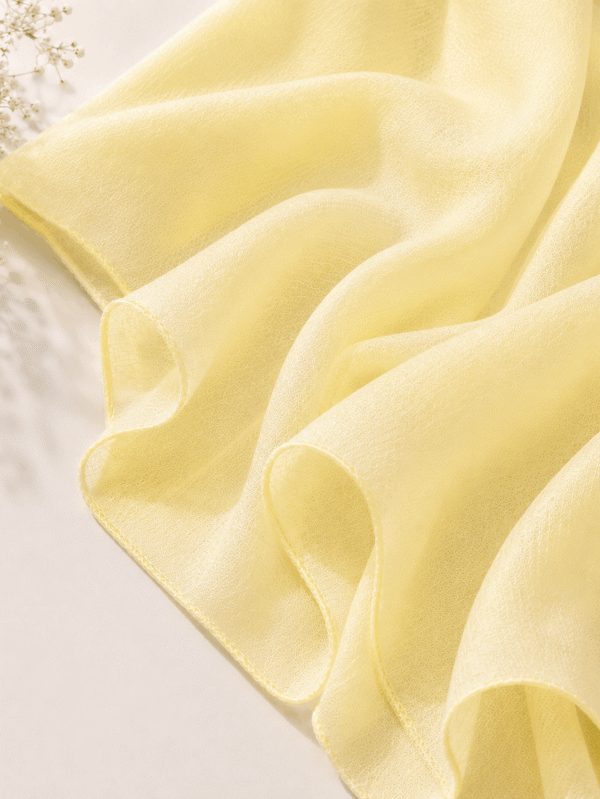 1. Butter yellow georgette chiffon hijab draped softly — RidaZe 2. Pastel yellow lightweight chiffon staller for Eid and daily wear — RidaZe 3. Close-up texture of butter yellow georgette hijab fabric — RidaZe Pakistan