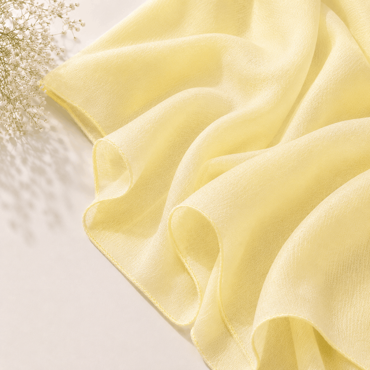 1. Butter yellow georgette chiffon hijab draped softly — RidaZe 2. Pastel yellow lightweight chiffon staller for Eid and daily wear — RidaZe 3. Close-up texture of butter yellow georgette hijab fabric — RidaZe Pakistan