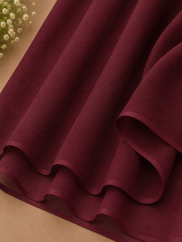 Maroon burgundy georgette chiffon hijab draped elegantly — RidaZe 2. Deep wine colour lightweight chiffon staller for university and winter — RidaZe 3. Close-up texture of dark maroon georgette hijab fabric — RidaZe Pakistan